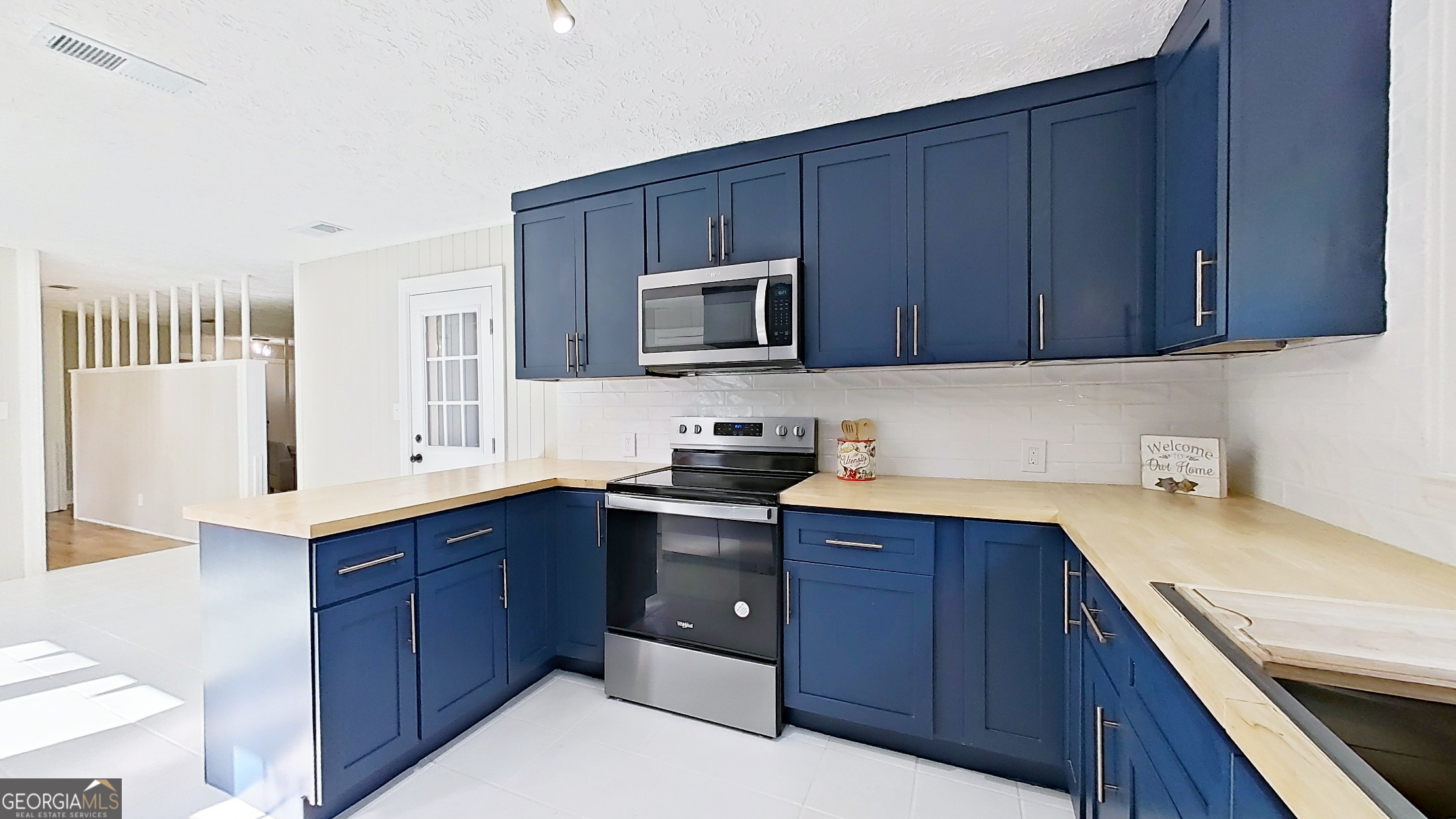 481 4th Street Southeast Cairo, GA 39828 - Photo 15 of 55 a kitchen with stainless steel appliances granite countertop wooden cabinets a sink and dishwasher