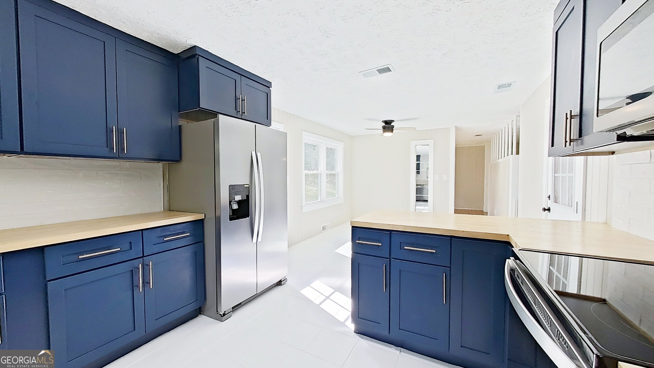 481 4th Street Southeast Cairo, GA 39828 - Photo 16 of 55 a kitchen with stainless steel appliances a refrigerator and cabinets