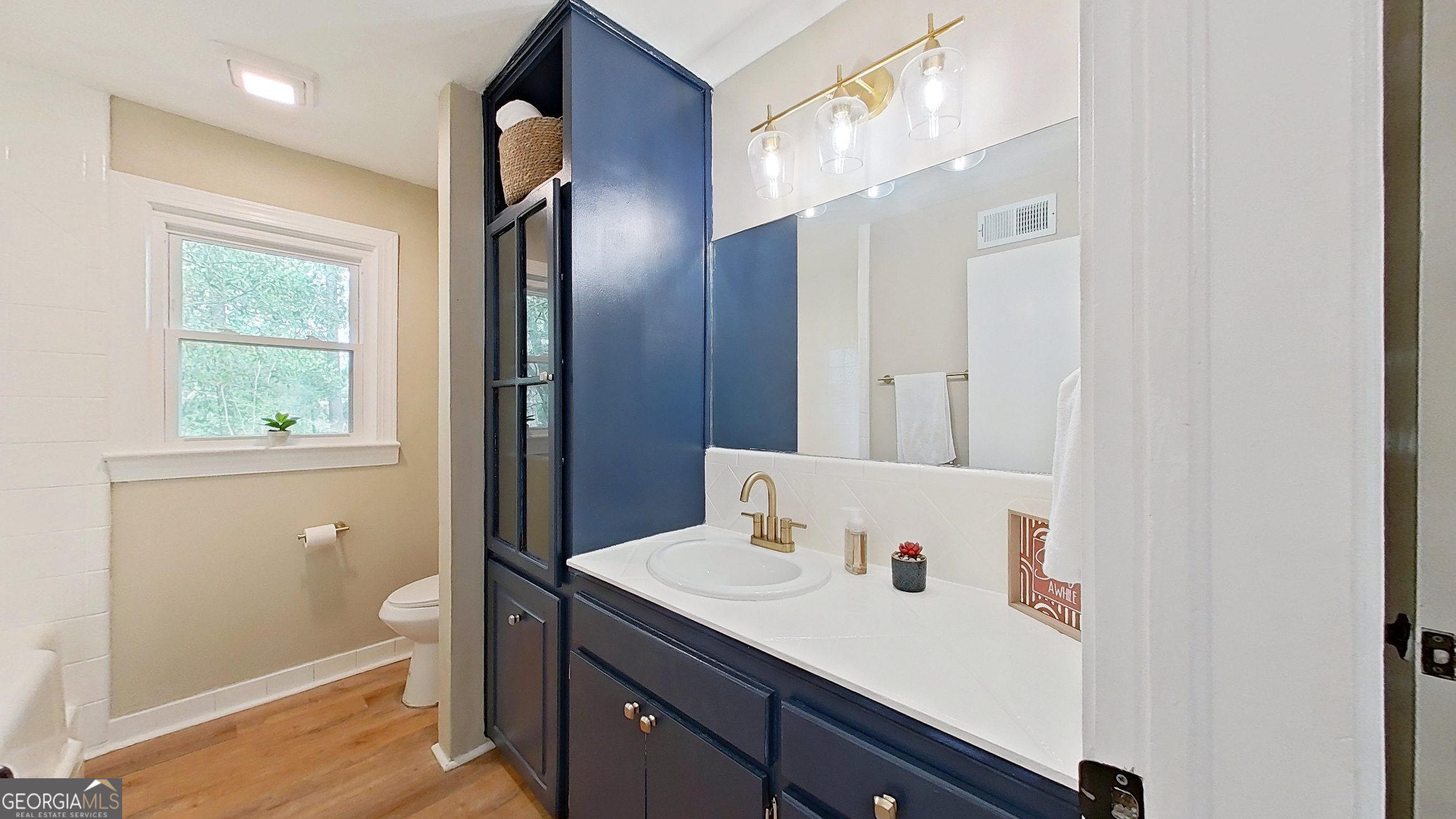 481 4th Street Southeast Cairo, GA 39828 - Photo 27 of 55 a view of bathroom with a sink mirror and next to a window