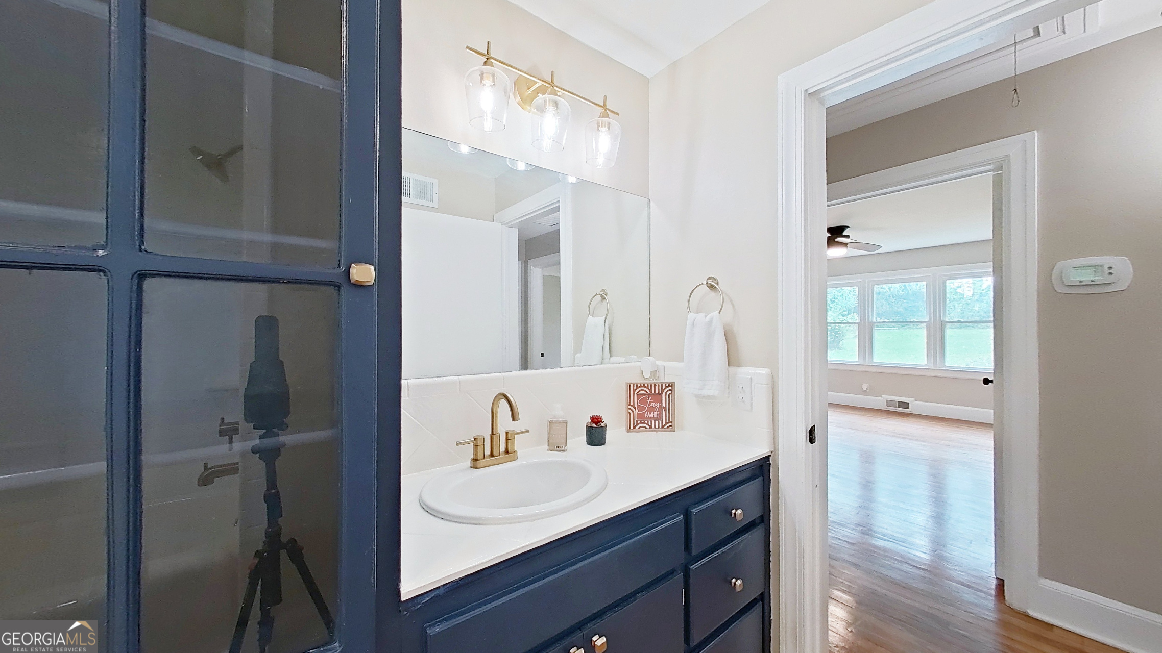 481 4th Street Southeast Cairo, GA 39828 - Photo 28 of 55 a bathroom with a sink vanity and mirror