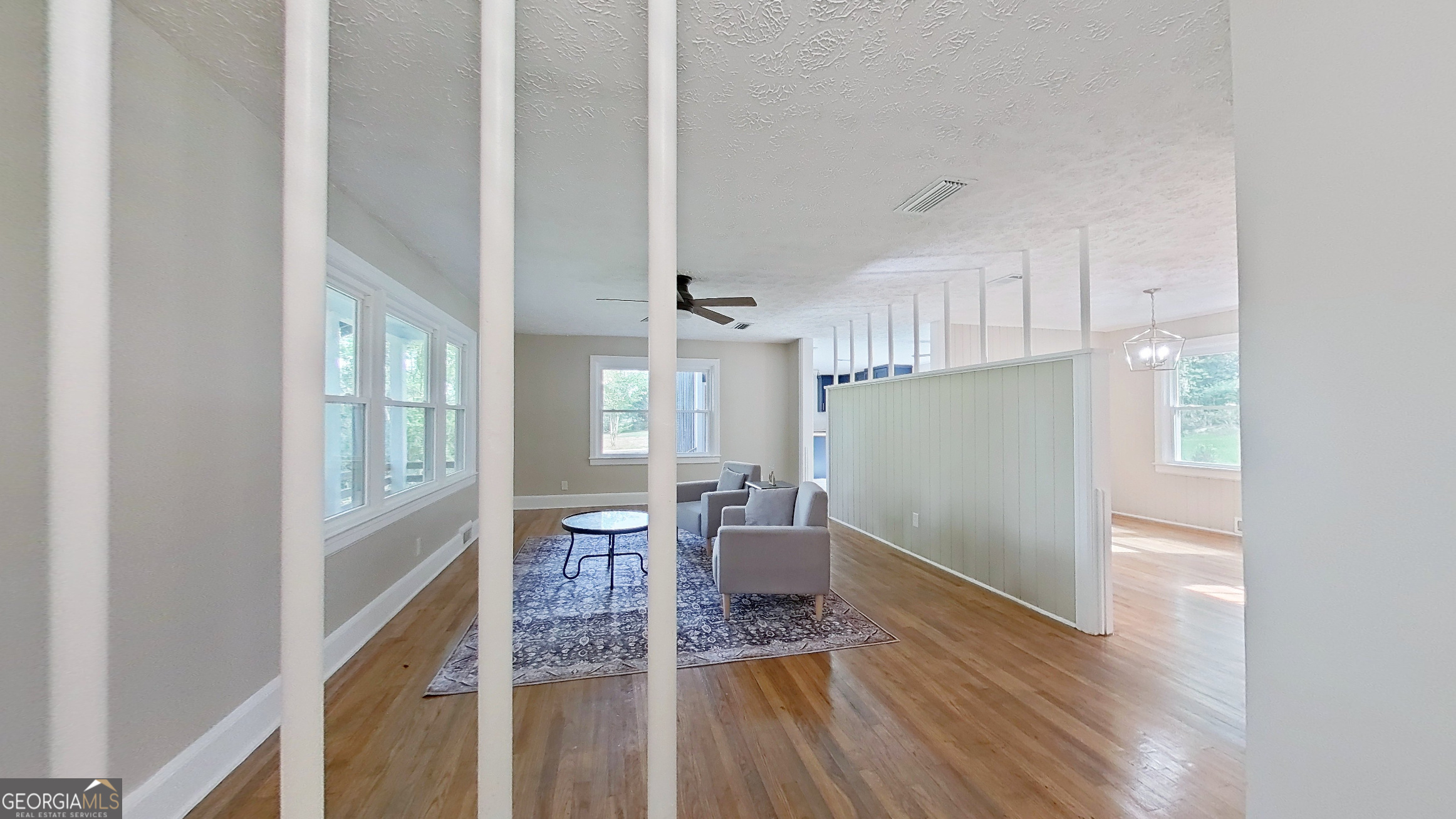 481 4th Street Southeast Cairo, GA 39828 - Photo 3 of 55 a view of a hallway with furniture and wooden floor