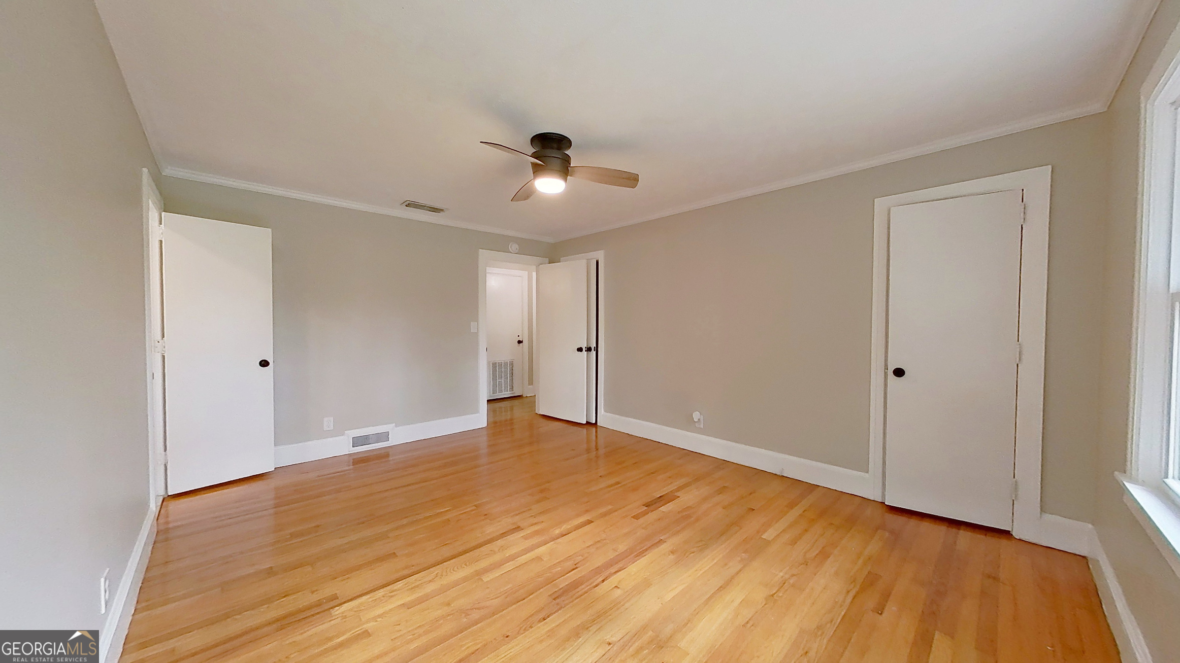 481 4th Street Southeast Cairo, GA 39828 - Photo 33 of 55 a view of an empty room with wooden floor