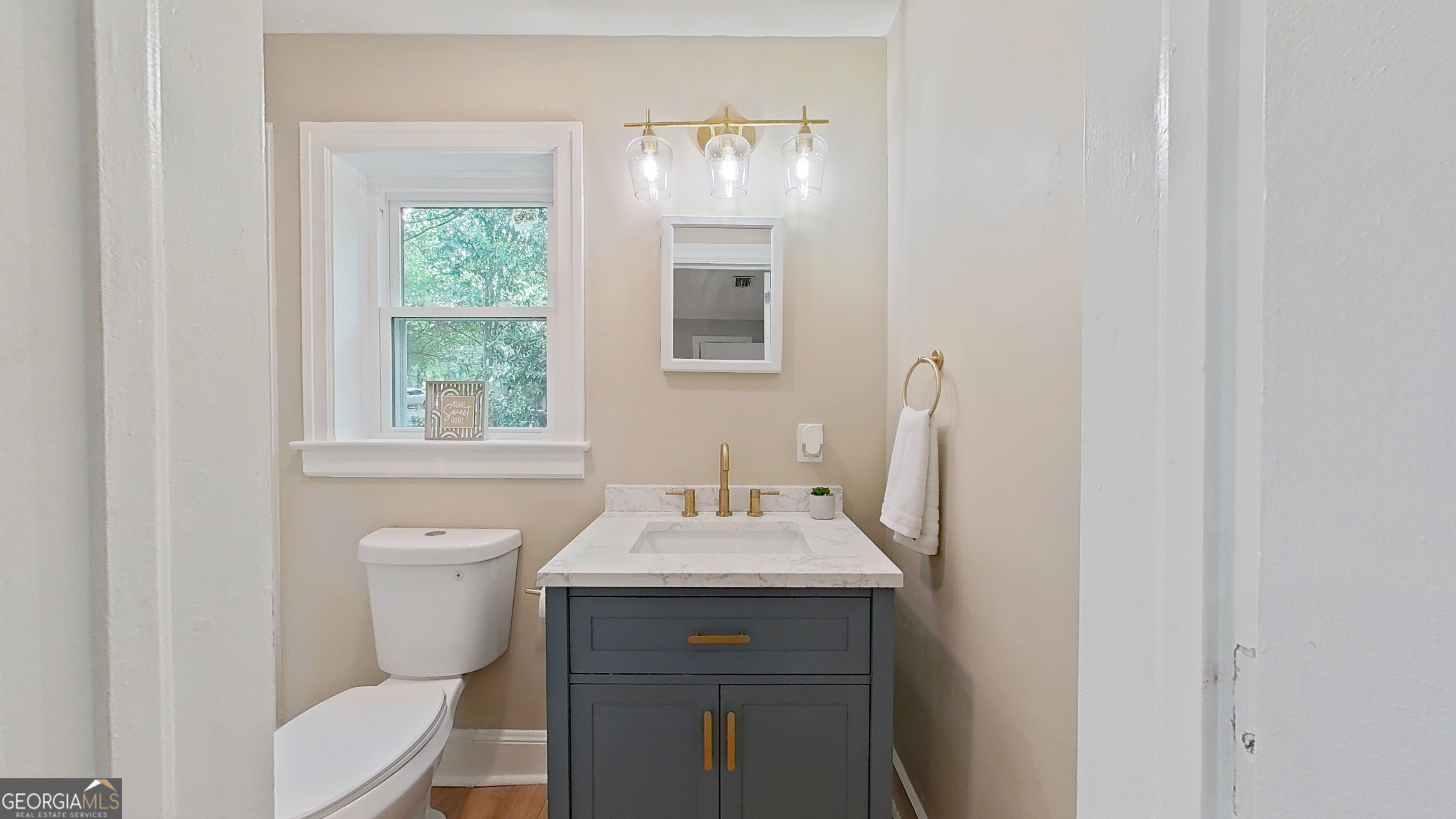 481 4th Street Southeast Cairo, GA 39828 - Photo 34 of 55 a bathroom with a sink vanity mirror and toilet
