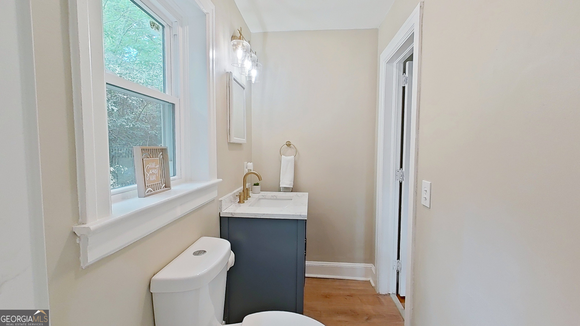 481 4th Street Southeast Cairo, GA 39828 - Photo 36 of 55 a bathroom with a toilet a sink and a mirror