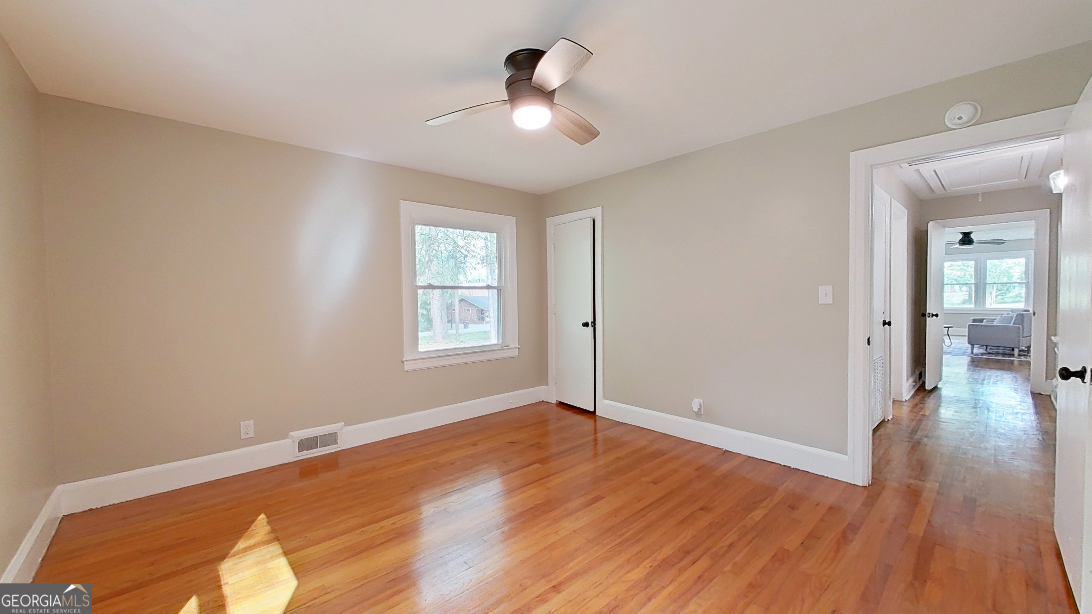 481 4th Street Southeast Cairo, GA 39828 - Photo 39 of 55 an empty room with wooden floor and windows