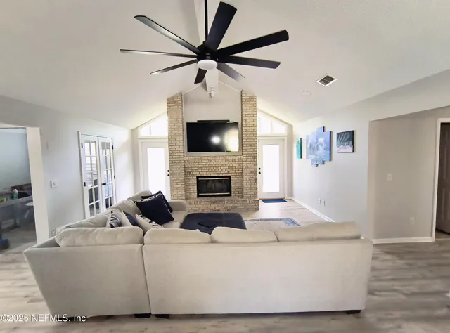 a living room with furniture and a fireplace