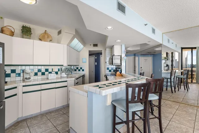 a view of a hallway view with wooden floor and living room