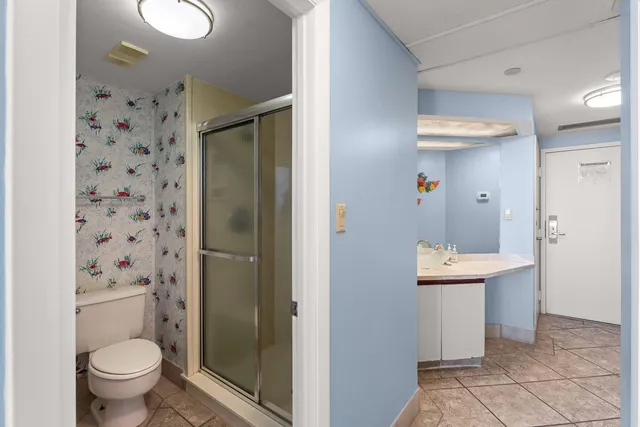 a bathroom with a sink mirror and vanity