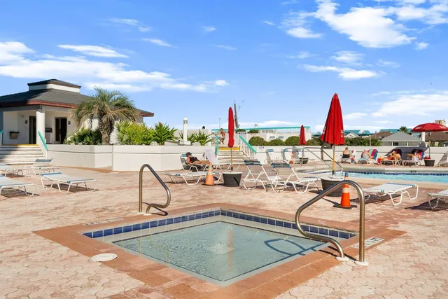 a view of swimming pool with outdoor seating