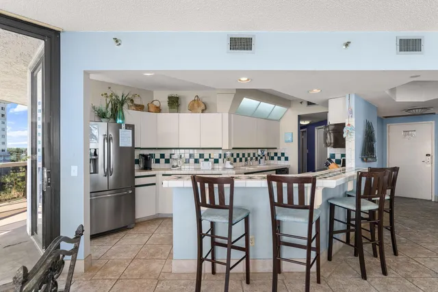 a kitchen with a table and chairs
