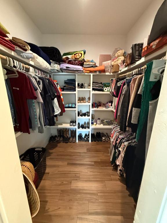 497 Brown Road McDade, TX 78650 - Photo 17 of 22 Spacious closet with wood finished floors