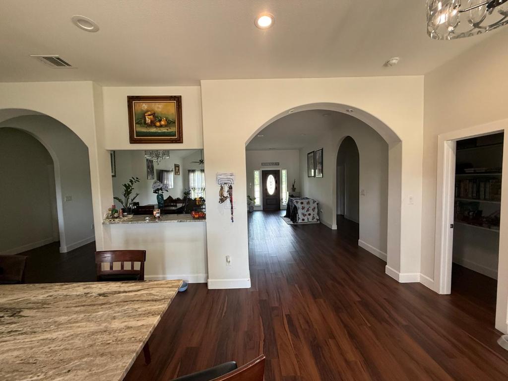 497 Brown Road McDade, TX 78650 - Photo 7 of 22 Hallway featuring wood finished floors, baseboards, and recessed lighting