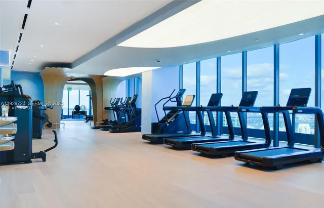 a view of living room with furniture and floor to ceiling window