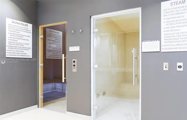 a bathroom with a tub shower and a sink