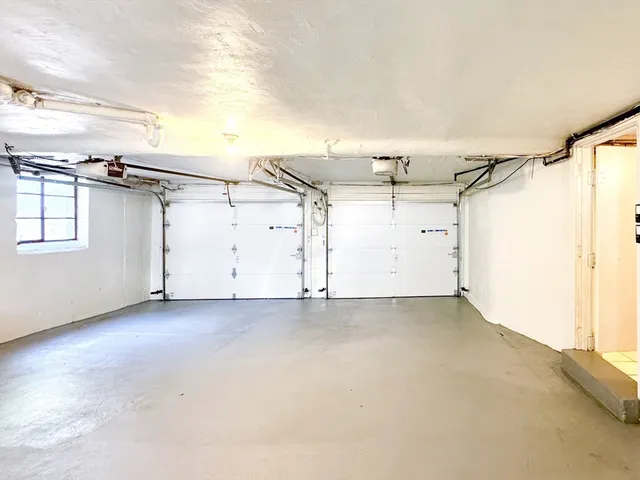 a view of an empty room and wooden floor