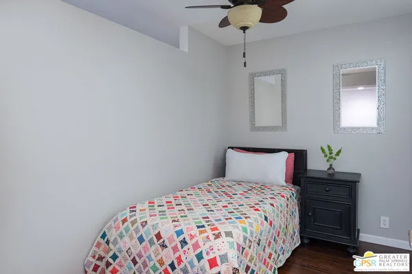 a bedroom with a bed and dresser