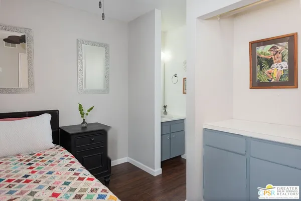a bedroom with a bed and a cabinets