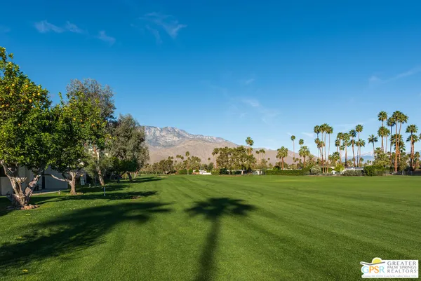 a view of a golf course with a lake