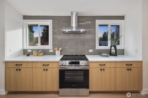 a kitchen with a stove and a sink