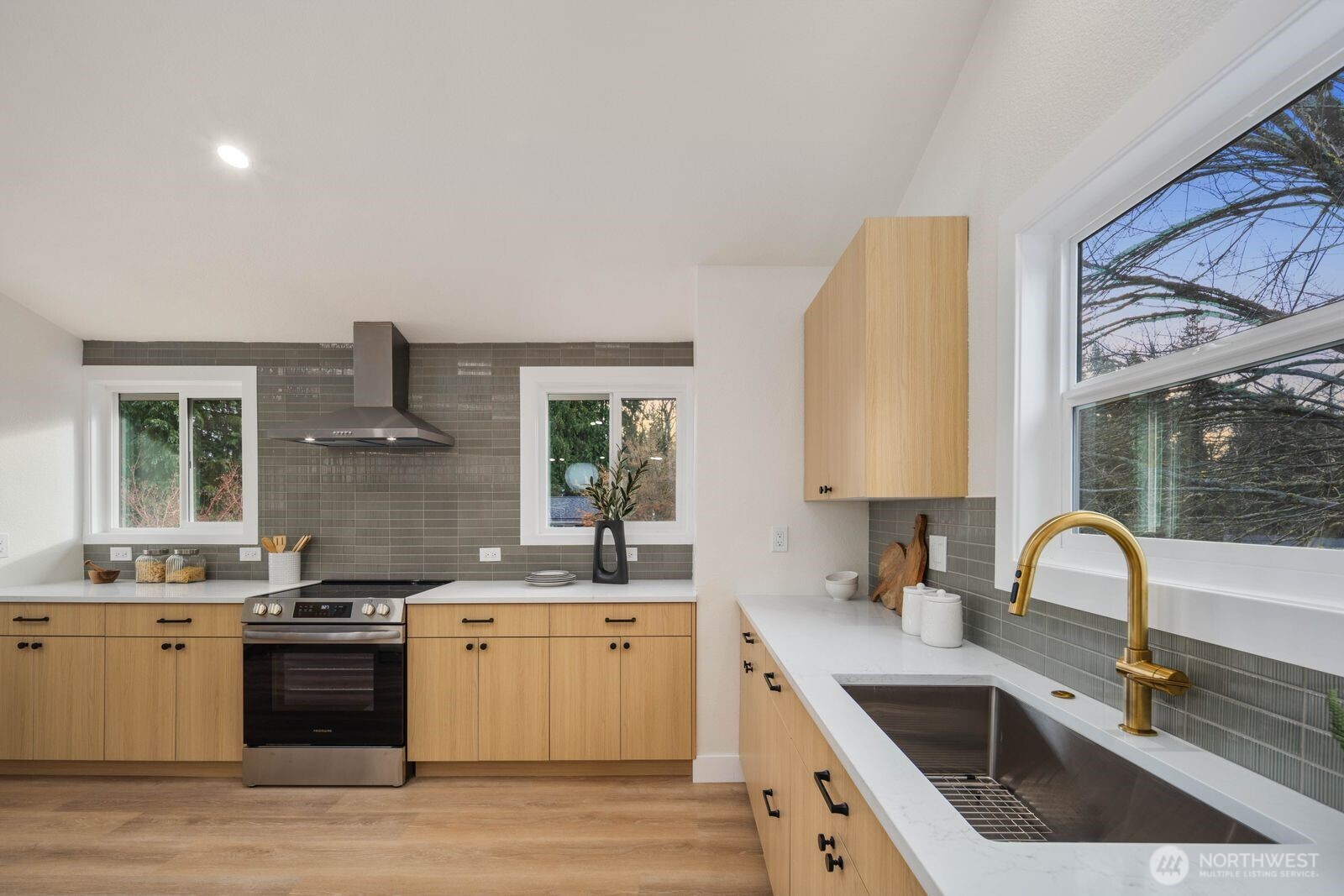 2525 178th Street Southeast Bothell, WA 98012 - Photo 14 of 39 a kitchen with a sink stove and cabinets
