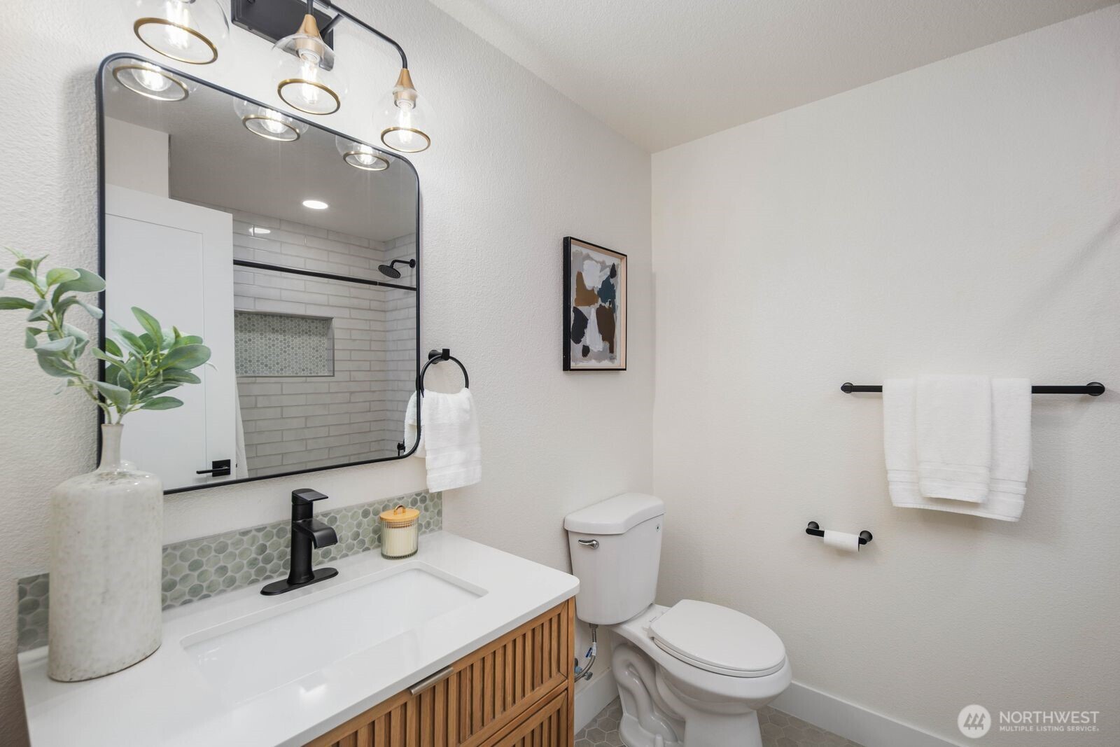 2525 178th Street Southeast Bothell, WA 98012 - Photo 18 of 39 a bathroom with a sink a toilet and mirror