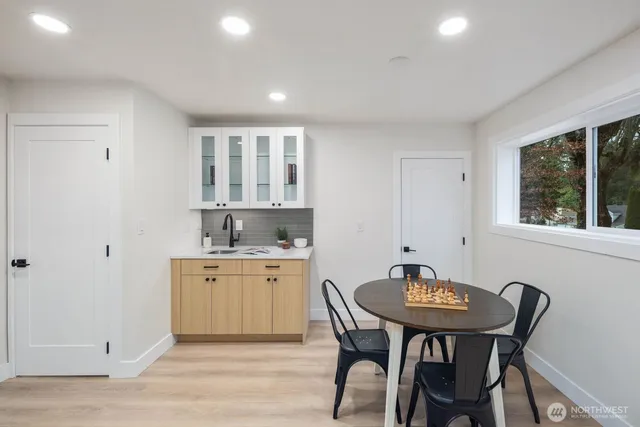 a view of a dining room with furniture and window