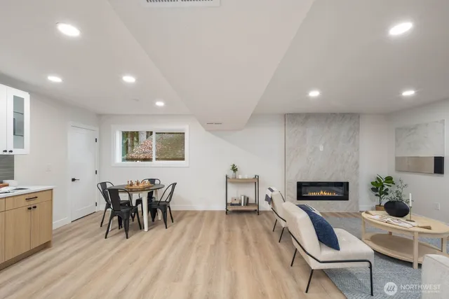 a view of a dining room with furniture and wooden floor