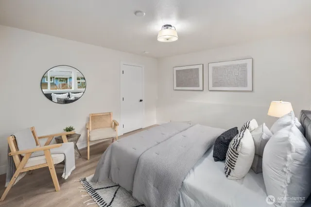 a bedroom with a bed and chandelier