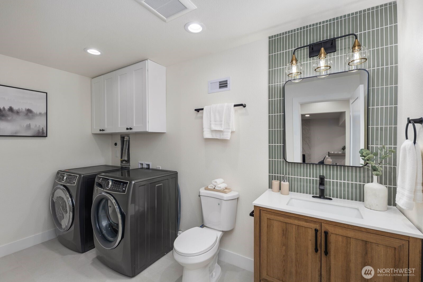 2525 178th Street Southeast Bothell, WA 98012 - Photo 30 of 39 a view of bathroom with a toilet sink and mirror