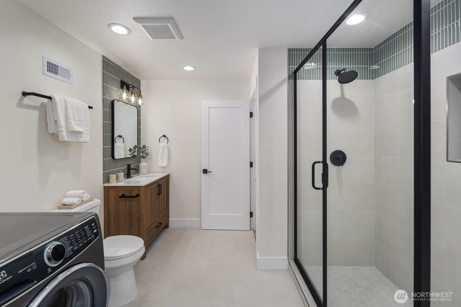 2525 178th Street Southeast Bothell, WA 98012 - Photo 31 of 39 a bathroom with a granite countertop sink toilet and shower