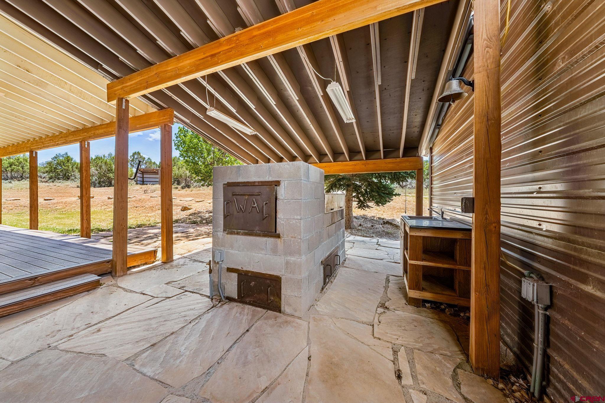 22480 Rd L Cortez, CO 81321 - Photo 28 of 44 a view of living room kitchen outdoor seating and mountain view