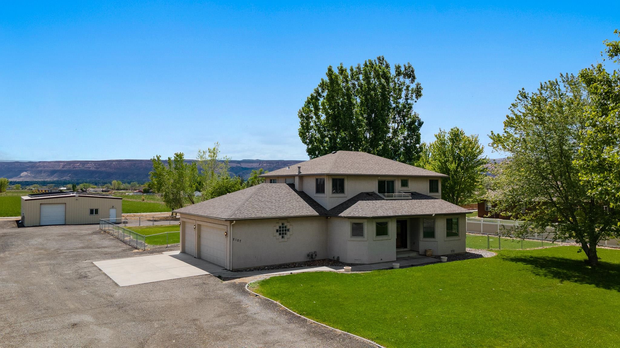 2107 I I- 1/2 Road Grand Junction, CO 81505 - Photo 1 of 42 a view of a house with backyard and sitting area