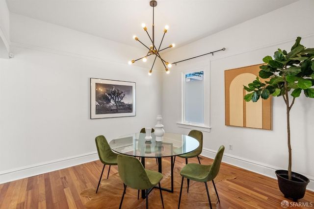 a view of a hallway view with wooden floor and staircase