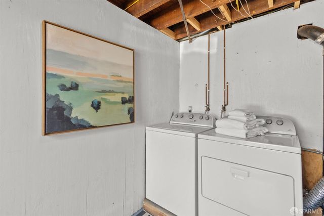 a front view of a house with a tree