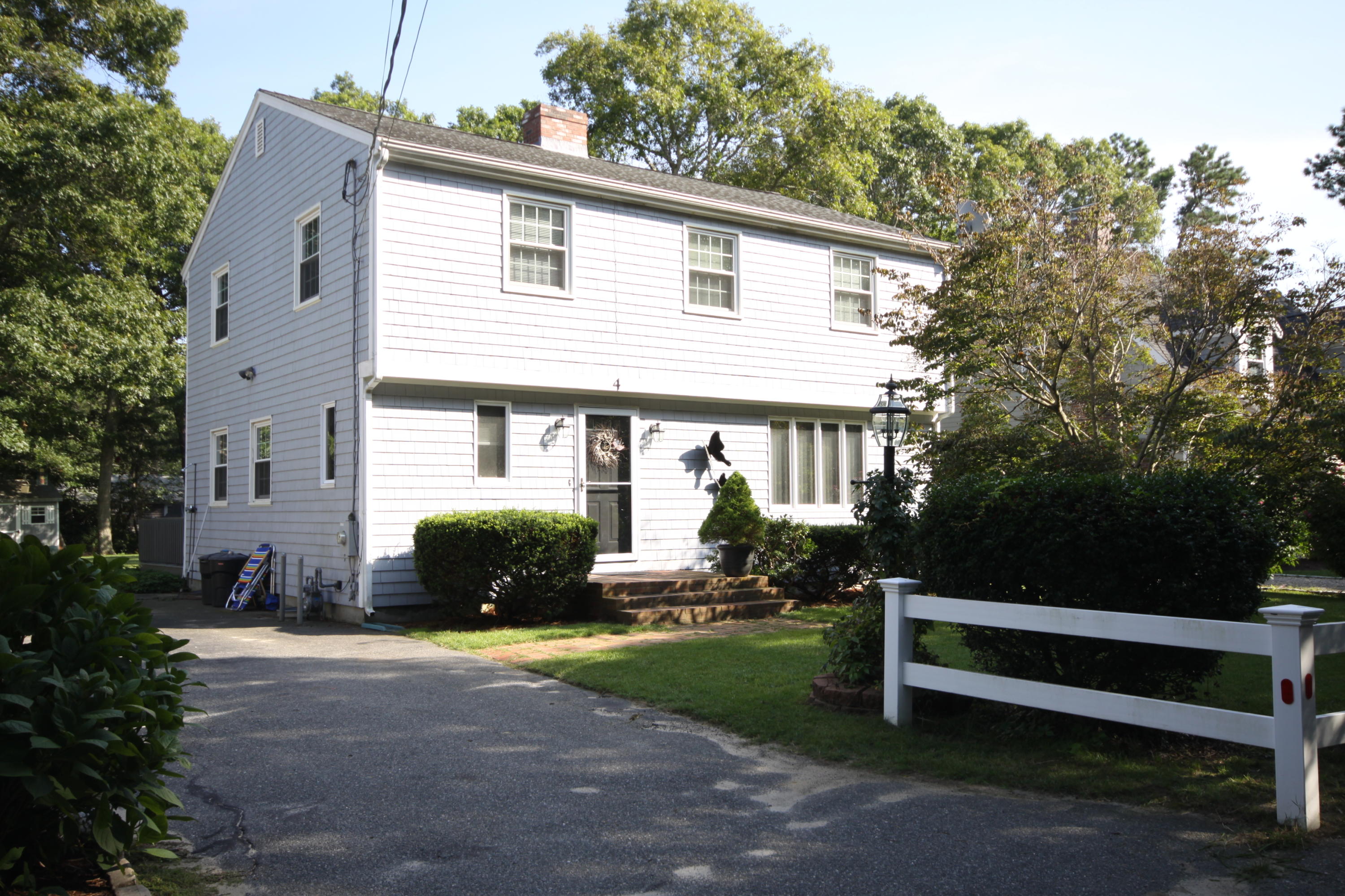 4 Alma Road Mashpee, MA 02649 - Photo 1 of 19 a front view of a house with a yard