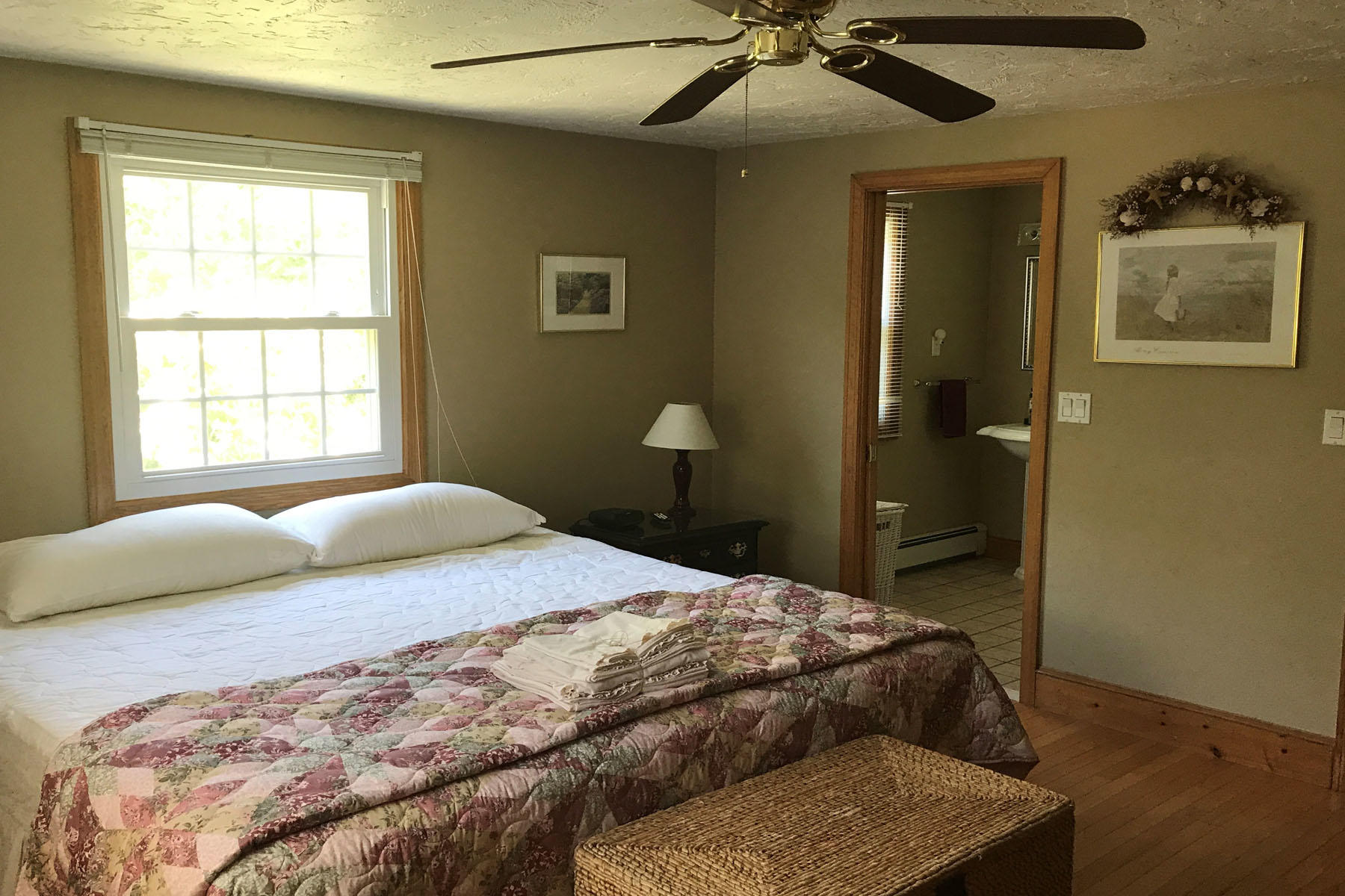 4 Alma Road Mashpee, MA 02649 - Photo 15 of 19 a bedroom with a bed and a chandelier