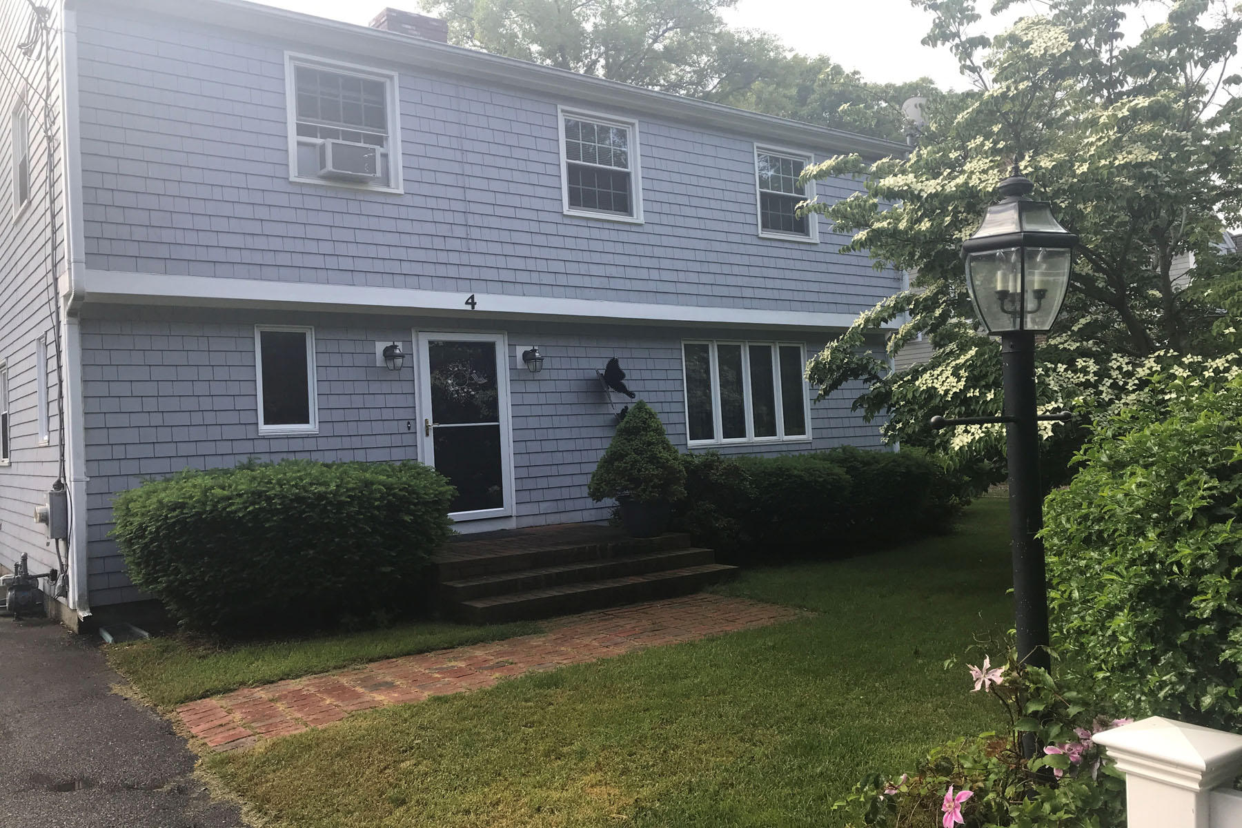 4 Alma Road Mashpee, MA 02649 - Photo 2 of 19 a view of a house with backyard and garden