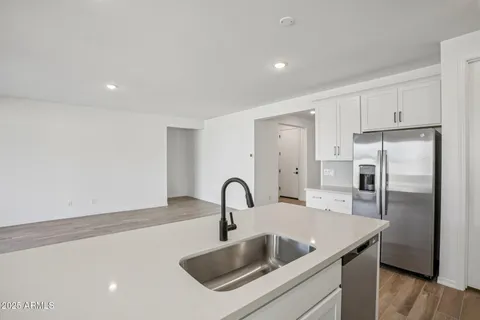 a view of an empty room with windows