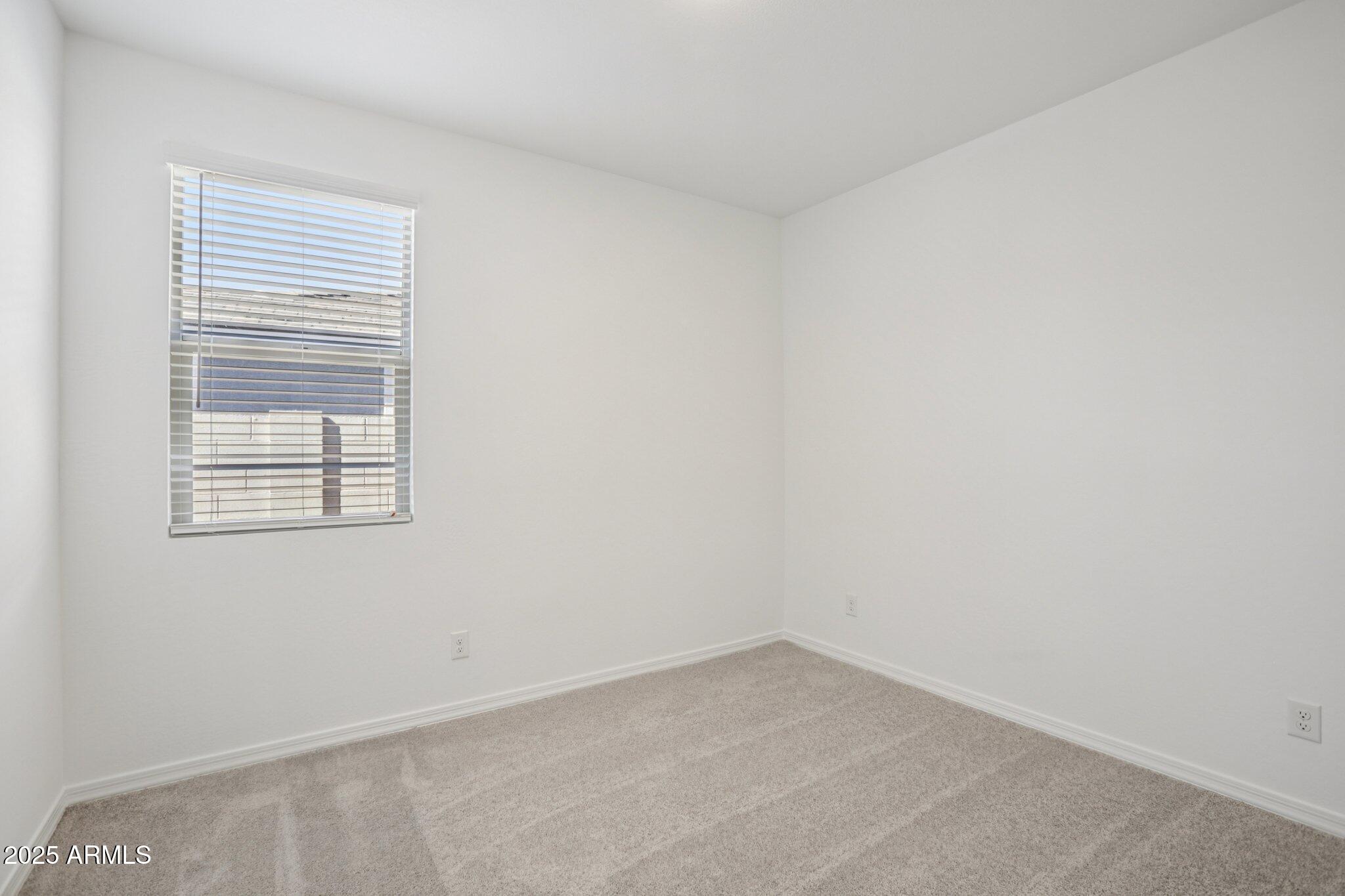 5528 West Hopi Trail Laveen, AZ 85339 - Photo 18 of 51 an empty room with a window