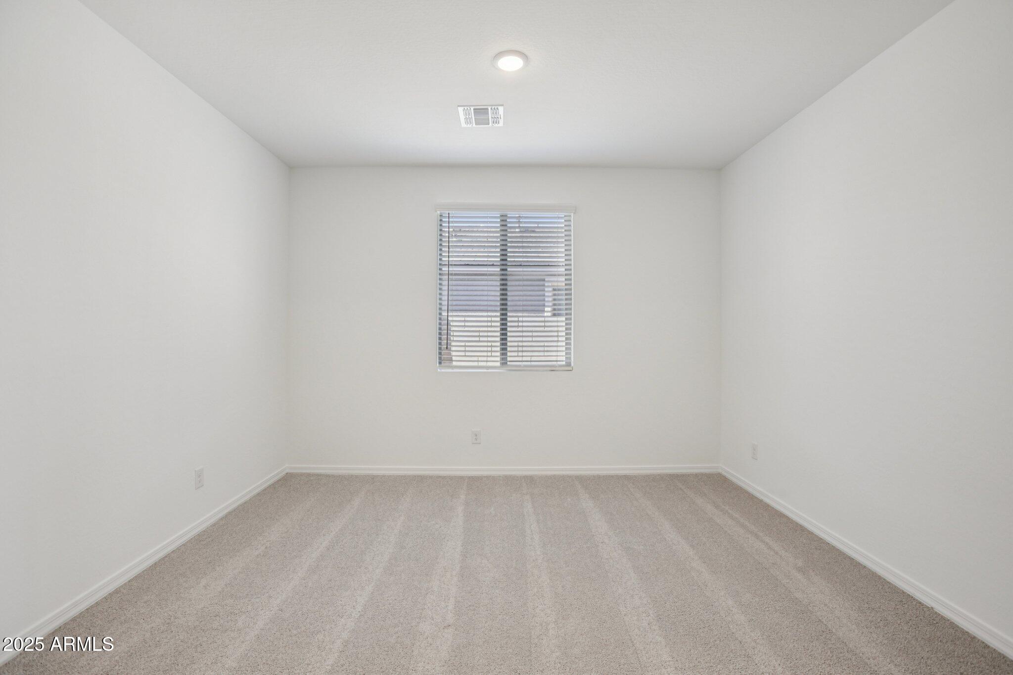 5528 West Hopi Trail Laveen, AZ 85339 - Photo 19 of 51 an empty room with a window