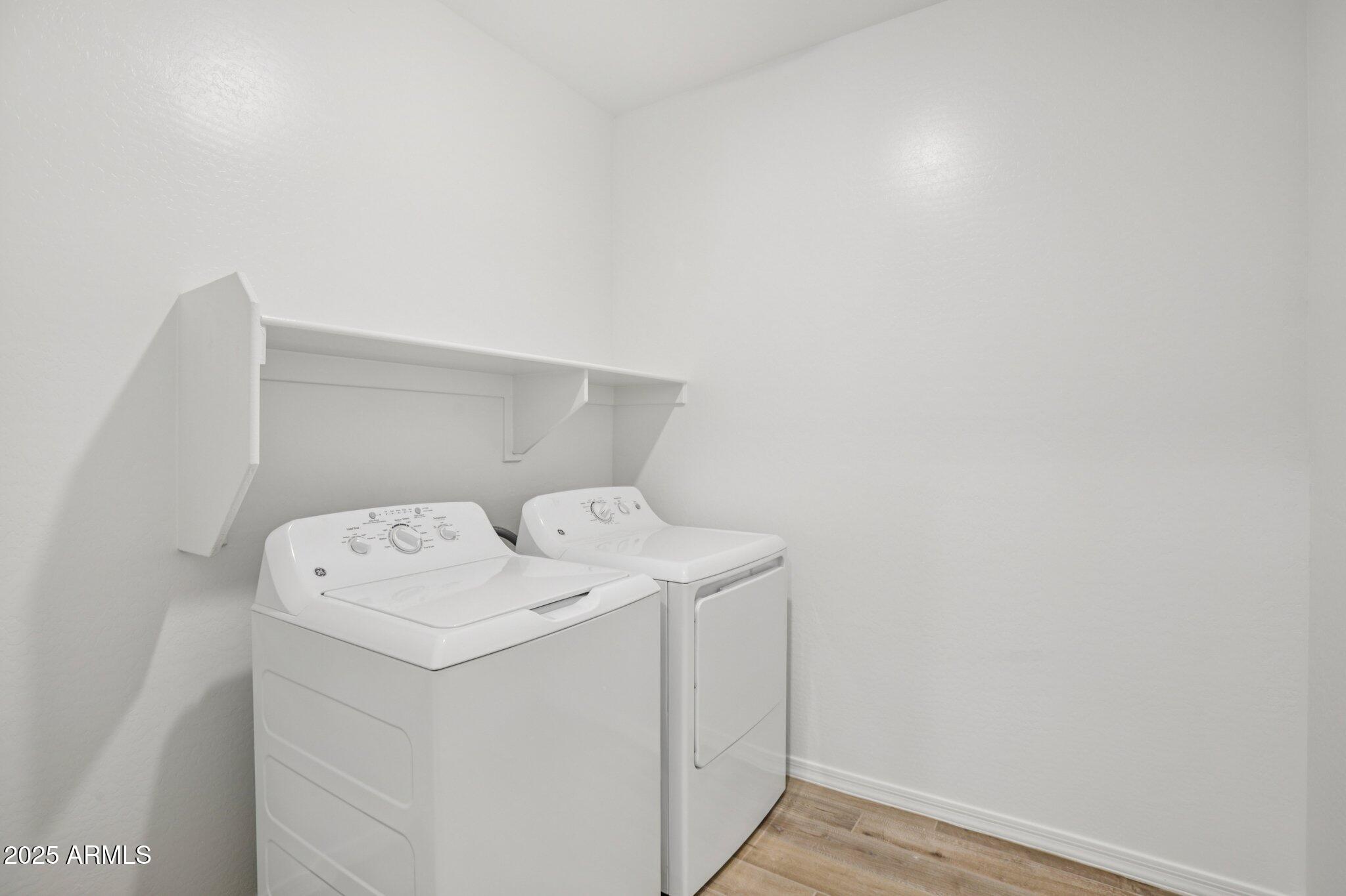 5528 West Hopi Trail Laveen, AZ 85339 - Photo 22 of 51 a utility room with dryer and washer