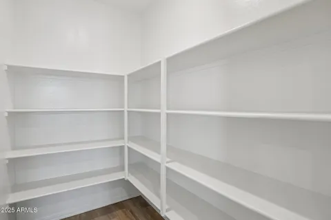 a bathroom with a shower and a glass door