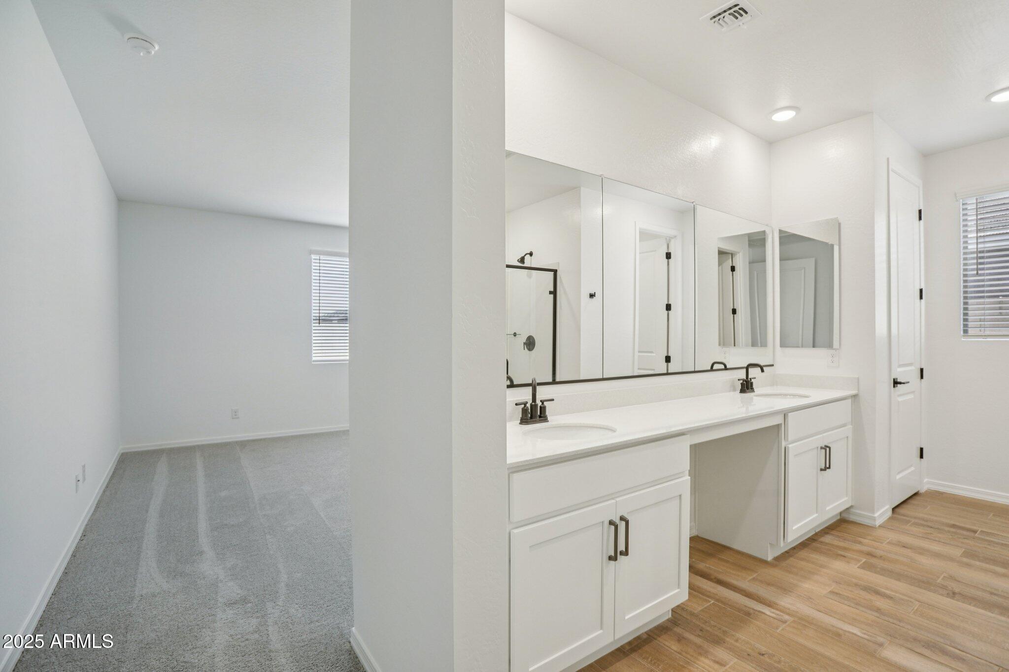 5528 West Hopi Trail Laveen, AZ 85339 - Photo 24 of 51 a spacious bathroom with a double vanity sink mirror and