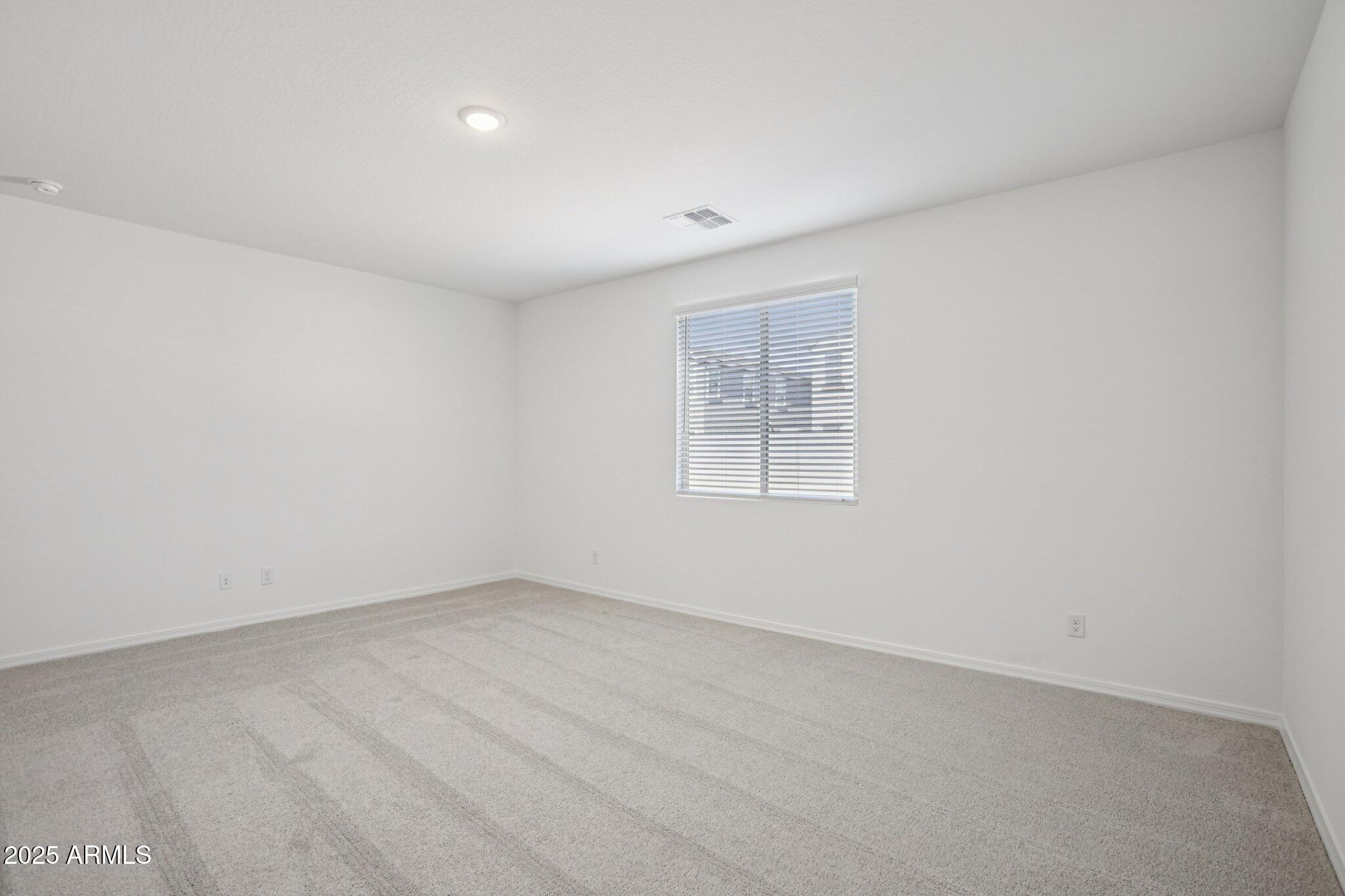 5528 West Hopi Trail Laveen, AZ 85339 - Photo 26 of 51 an empty room with windows