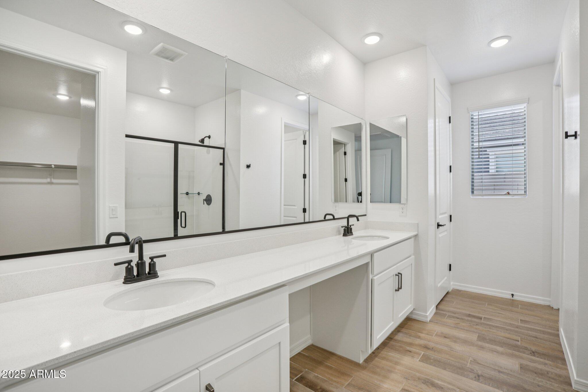 5528 West Hopi Trail Laveen, AZ 85339 - Photo 27 of 51 a bathroom with a double vanity sink and a mirror