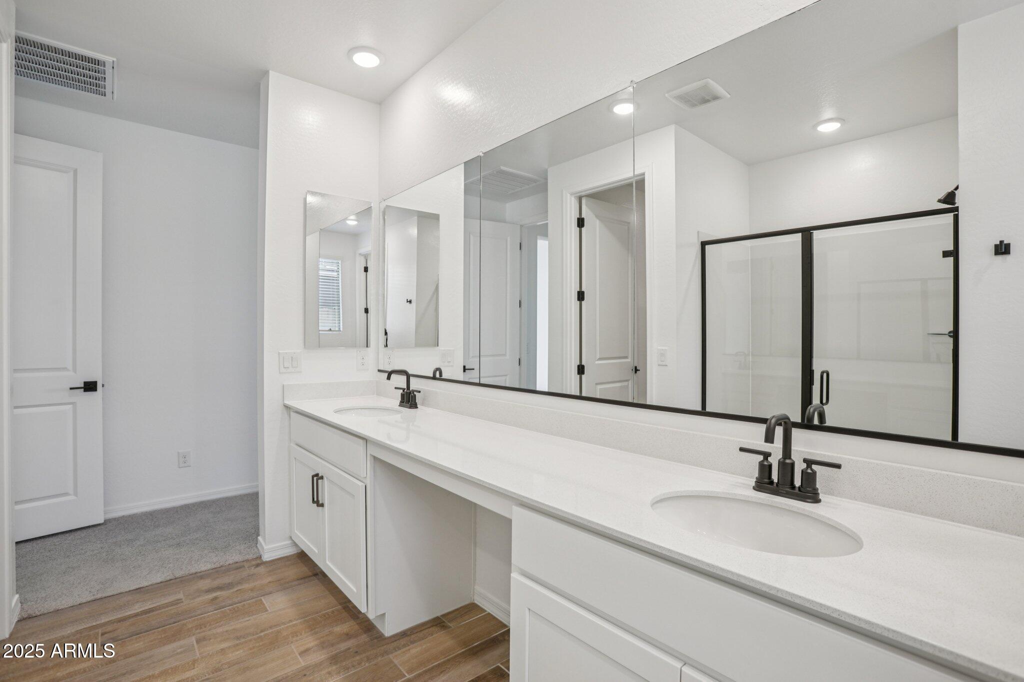 5528 West Hopi Trail Laveen, AZ 85339 - Photo 29 of 51 a bathroom with double sink and a mirror