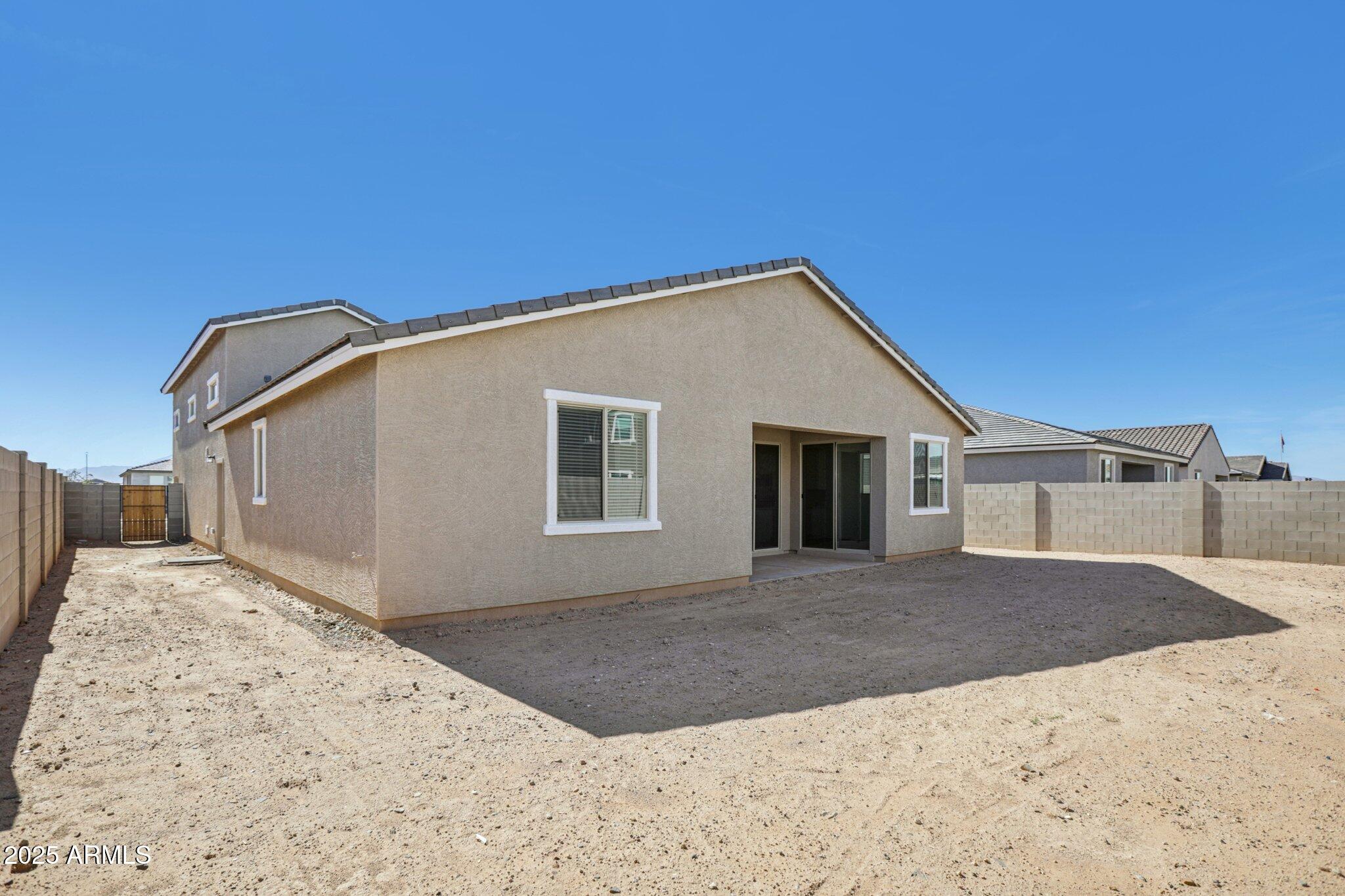 5528 West Hopi Trail Laveen, AZ 85339 - Photo 36 of 51 a view of a house with a backyard