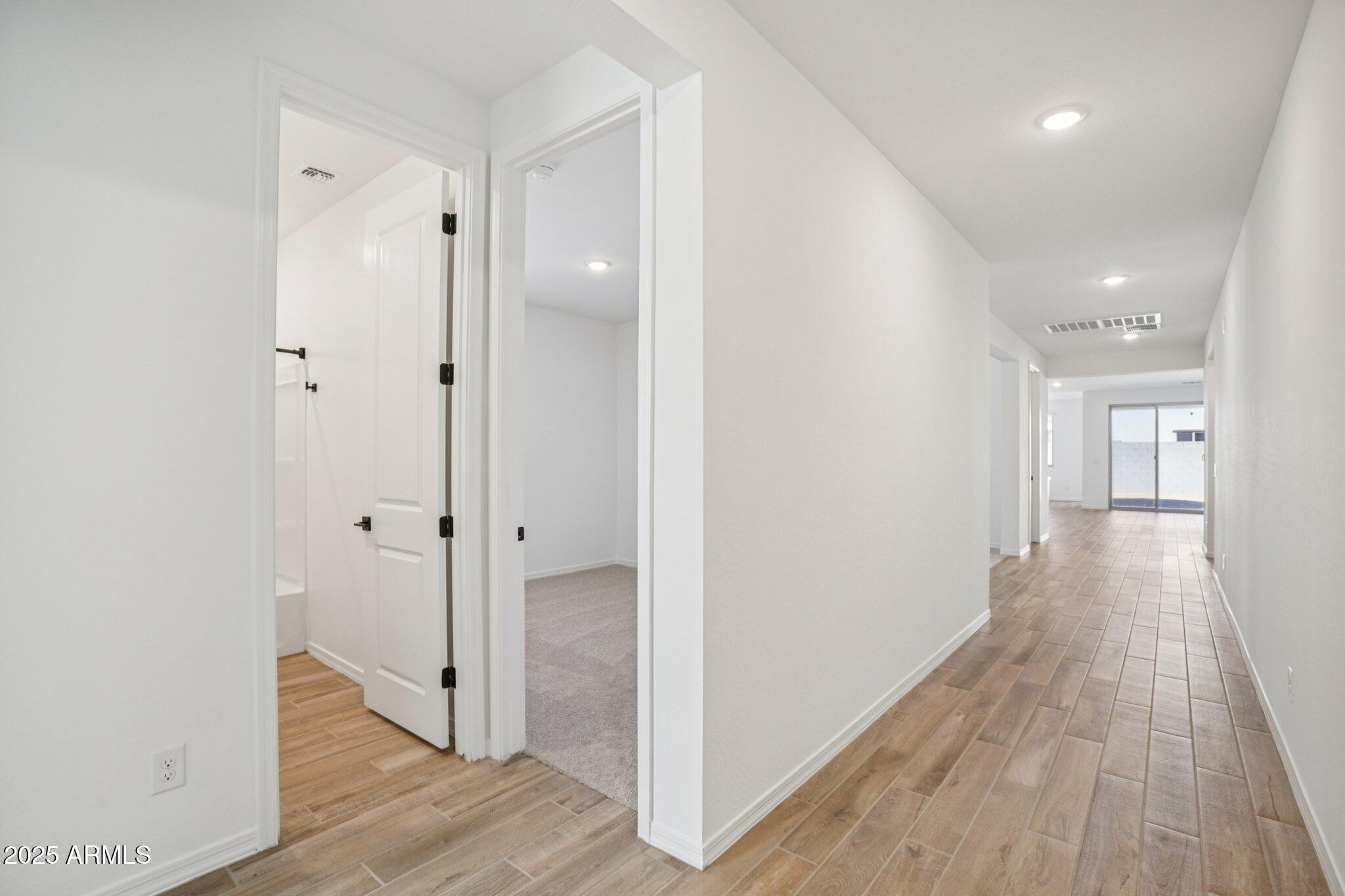 5528 West Hopi Trail Laveen, AZ 85339 - Photo 5 of 51 a view of a hallway with wooden floor