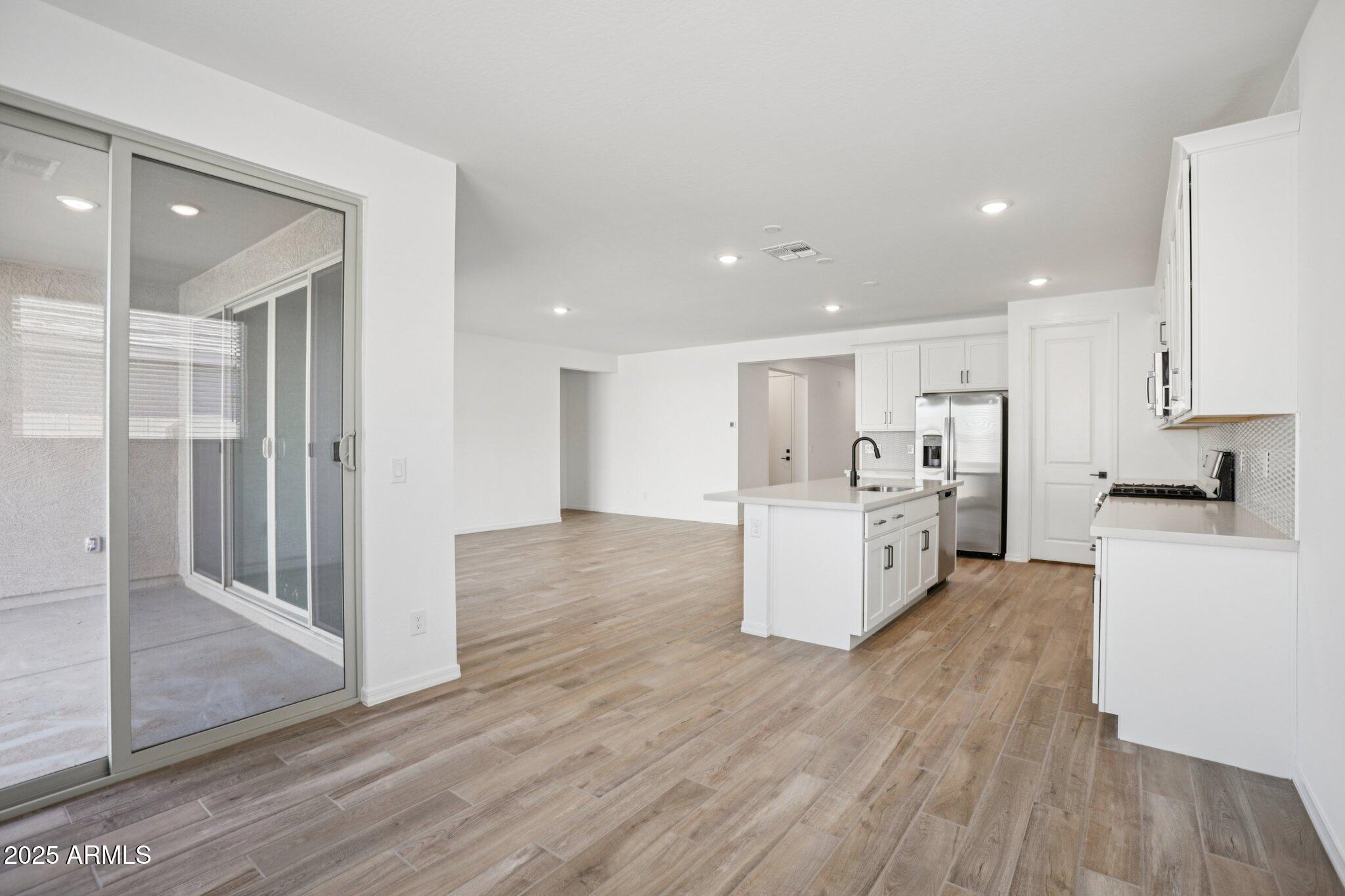 5528 West Hopi Trail Laveen, AZ 85339 - Photo 8 of 51 a view of kitchen with wooden floor