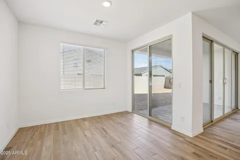 a kitchen with a sink a refrigerator and cabinets
